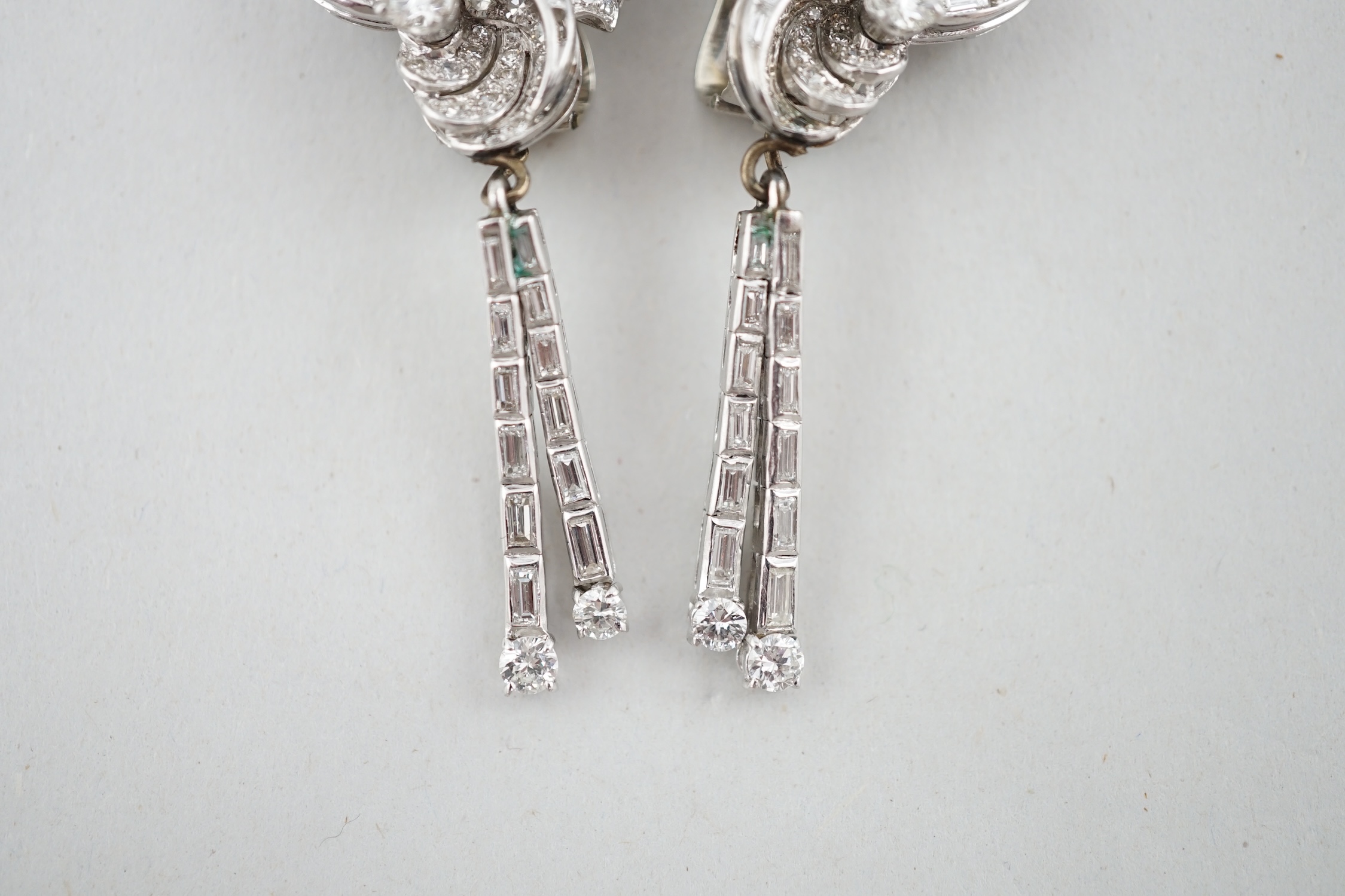 A pair of 1960's white gold and diamond cluster set drop ear clips